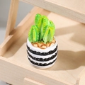 Miniature green cactus in white wavy-patterned pot on a wooden shelf, minimalist plant decor - No. 2 Wave Pattern Pot Succulent