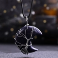 Close-up of Blue Sandstone moon pendant with silver Tree of Life wire wrap detail - Blue Sandstone