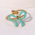 Gold plated stainless steel twisted ring with a turquoise enamel bow and open design - Cyan