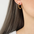 Bamboo style U-shaped hoop earrings in 18k gold plated stainless steel on model - F1246-Bamboo Hoop / Gold