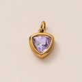 Detail of 18k gold plated pendant with a triangular light purple birthstone on beige background - February Birthstone Pendant (Amethyst)