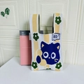 Knitted mini tote bag featuring yellow and white contrast with a blue cartoon cat design - Flower Cat White