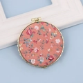 Portable round gold metal makeup mirror featuring a pink floral fabric pattern design - Round / Round Orange