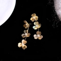 Retro gold tiered clover earrings with sparkling crystal accents on black velvet - Style 54 Silver Earring Post - Gold - Zirconia Hollow Clover
