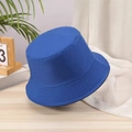 Detail shot of the cotton fabric texture on a blue minimalist reversible bucket hat - One Size / Royal Blue