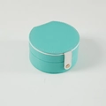 Teal leather round jewelry box with white handle and gold buckle detail - Tiffany Green