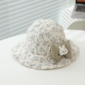 Detail of floral baby sun hat featuring a large green bow and a cute 3D bunny accessory - 50cm (1-3 Years) / Blue Floral