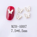 Detailed view of 7.5x6.5mm butterfly nail charms with gold edges and white inlay - White Gold Edge Large Butterfly Style (AB07)