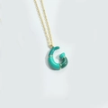 Golden O-chain necklace featuring an abstract green enamel G-shaped puff pendant - Letter G
