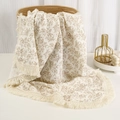 Detail of floral muslin baby blanket with fringe trim and soft cotton texture - Khaki Flower