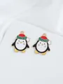 Close-up of DIY Christmas penguin charms with red hats and gold edges on white silk - Penguin With Hat (29)