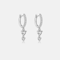 Macro shot of S925 sterling silver earrings with sparkling cubic zirconia charms - 925 Silver / Silver Plated White Zirconia