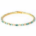 Detail of gold tennis bracelet with alternating blue rectangle and white round crystals - Sea Blue Zircon Gold
