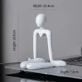 Modern white abstract figure sculpture sitting on a desk with 10.4cm x 10.9cm dimensions - Style A White