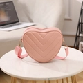 Pink heart-shaped crossbody bag with quilted leather texture and adjustable strap - Pink