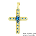 Macro shot of a gold-plated cross pendant with vibrant blue zircons on a white background - Pendant 21 (Gold Blue Stone Luxury Cross)