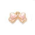 Pink enamel bow tie charm with gold alloy border and hanging loop for DIY jewelry - Pink