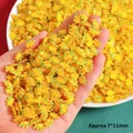 Close-up of mini yellow reindeer resin charms measuring 7x11mm for DIY nail art and crafts - 1 Piece / Mini Bell