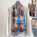 Blue silk scarf with harbor oil painting print hanging on a beige blazer hanger - Greek Town