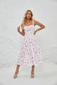 Close-up of a floral midi sun dress with thin straps and a delicate bow tie on the chest - White with Purple Leaves