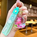 Detail of mint green liquid keychain with pink bunny inside and silicone wrist strap - Green [space Bag] Airplane Fabric