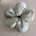 Close-up of light green silk scrunchie with a soft cloud-like texture and glossy finish - 3D Flower Scrunchie - Green (Original)