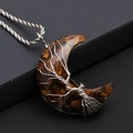 Macro view of handmade silver wire-wrapped tree of life on tiger eye moon pendant - Tiger Eye Moon - Silver Twist Chain