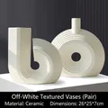 Modern creamy white ceramic vase set with spiral and hollow circle minimalist designs - Cream White Vase Pair 2181