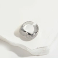 Silver open heart ring with micro-paved zircons on white marble textured surface - Pave Zirconia Heart Design (Silver)