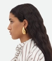 Modern gold hollow teardrop earrings with mirror polish finish on a female model - Extra Large Gold (43mm*25mm)