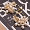 Golden hoop earrings with baroque pearls on New York City display card - White Pearl Set Hoop Earrings