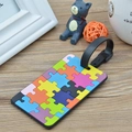 Geometric jigsaw puzzle pattern luggage tag with black leather strap on wooden surface - Jigsaw Puzzle