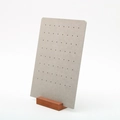 Gray perforated earring display stand with a solid wooden base for jewelry showcase - 64-Hole Earring Rack Grey
