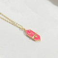 Fuchsia hexagonal enamel bee pendant with gold chain on white leather background - Rose Red