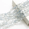 Macro shot of transparent blue rhombic glass crystal beads for DIY jewelry making - Light Blue Grey