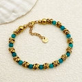 Bracciale minimalista in acciaio dorato con perline verde petrolio e chiusura a moschettone - Blu