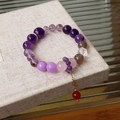 Detail view of colorful fluorite beaded bracelet with gold chain and red pendant charm - 23# Purple Red Ball
