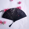 Classic black folding fan with white bamboo leaves, black tassel, and pink floral decor - Black Style with White Bamboo Leaf (Women's Fan - 39)