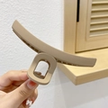 Elegant matte cream hair claw clip for high ponytail styling held in hand - 16# Coffee Bar Style Matte Surface