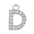 Close-up of silver-tone letter D pendant with sparkling crystal rhinestones for DIY - Letter D
