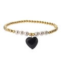 Detail of beaded bracelet with gold metal beads, white pearls and blue heart charm - Blue Sandstone