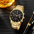 Detail of gold quartz watch with black dial and chronographs on a textured surface - Gold Case Black Dial