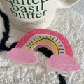 Detail of rainbow-shaped hair claw with pink clouds and vibrant pastel resin finish - 9.7cm / Pink Cloud