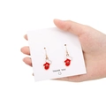 Christmas themed red glove earrings with golden edging shown on a thank you card - 15mm Christmas Glove Style 2