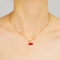 Close-up of a model wearing the cherry necklace with gold chain and red crystal pendant - Gold Red Cherry Necklace (6392301HB)