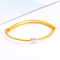 Adjustable yellow braided lucky heart bracelet with a silver heart pendant on white background - Yellow/Silver