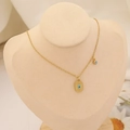 Close-up of golden evil eye pendant necklace on a beige jewelry display stand - 6# Necklace-Rectangular Plate Pendant