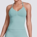 Detail view of mint green seamless ribbed yoga vest with ruched V-neck and halter straps - Pale Green