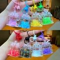 Porte-clés bouteille château de sable mouvant en acrylique avec cloches de 8 couleurs - Style Fermoir Mousqueton / Style de château lumineux (Mélange aléatoire)