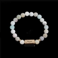 Detail of beaded natural stone bracelet with engraved bronze Faith metal charm - Matte Blue Grey Stone-Faith